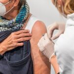 Elderly Woman Receives COVID-19 Vaccination